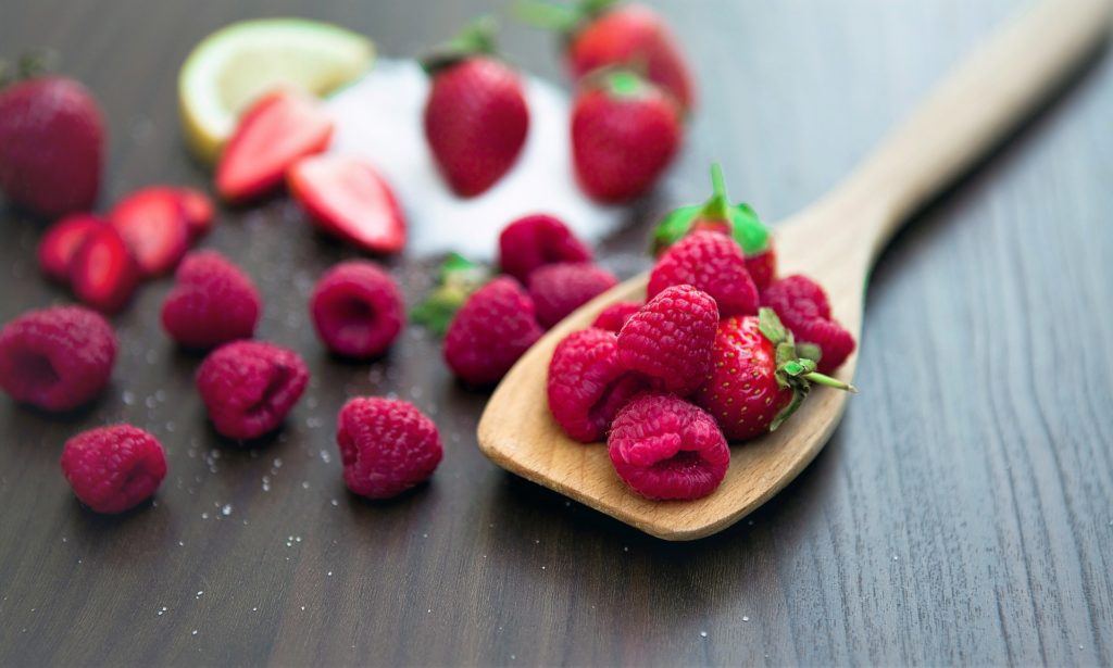 Raspberries on a wooden spatula